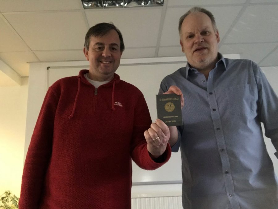 Oliver Burt and John Lowe holding their Showmen's Guild Membership Card