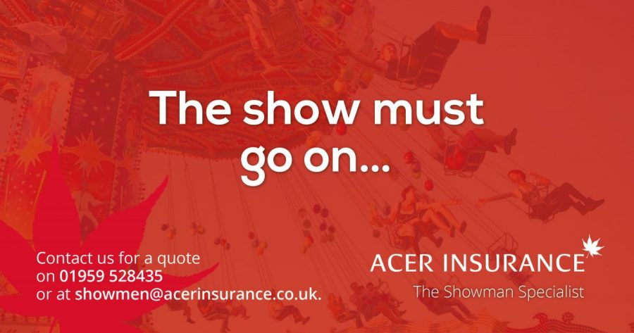 A chair-o-plane fairground ride with a red tint with the words the show must go on...